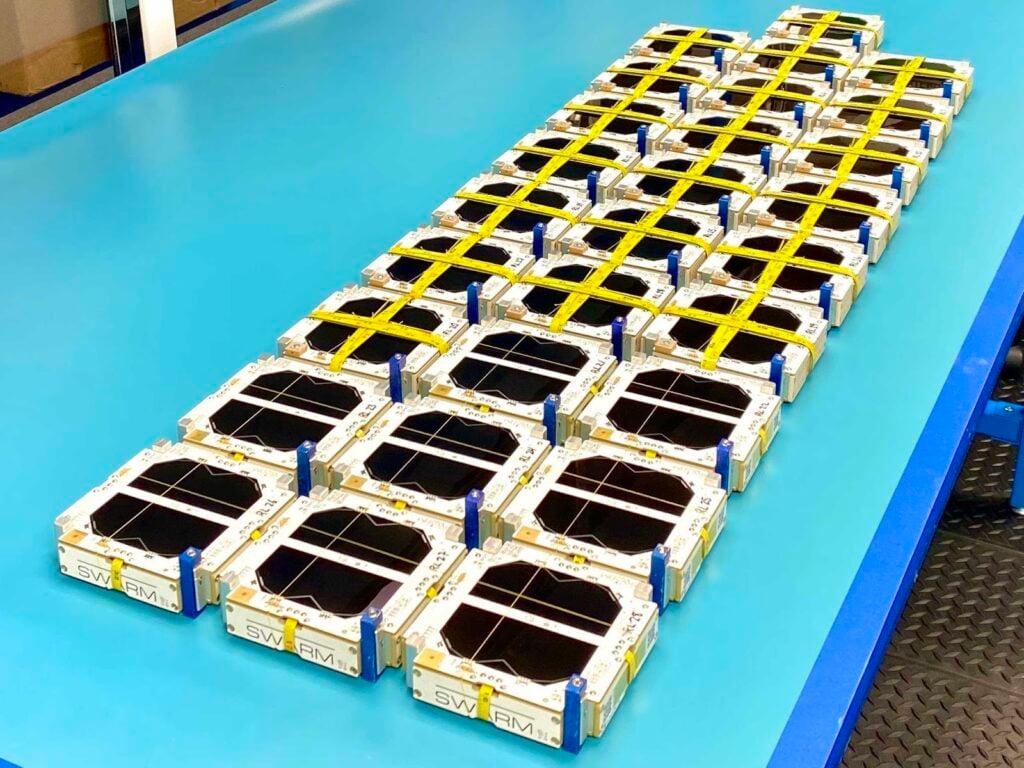 An image showing Swarm's satellites on a table